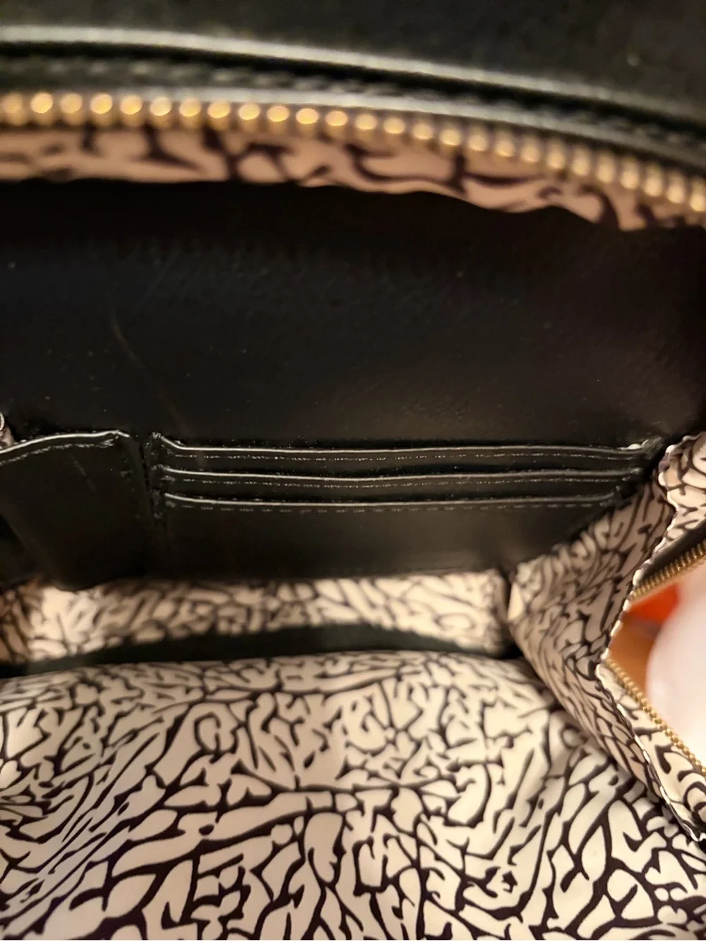 INC International Concepts Black Leather Interior with Cream Patterned Lining